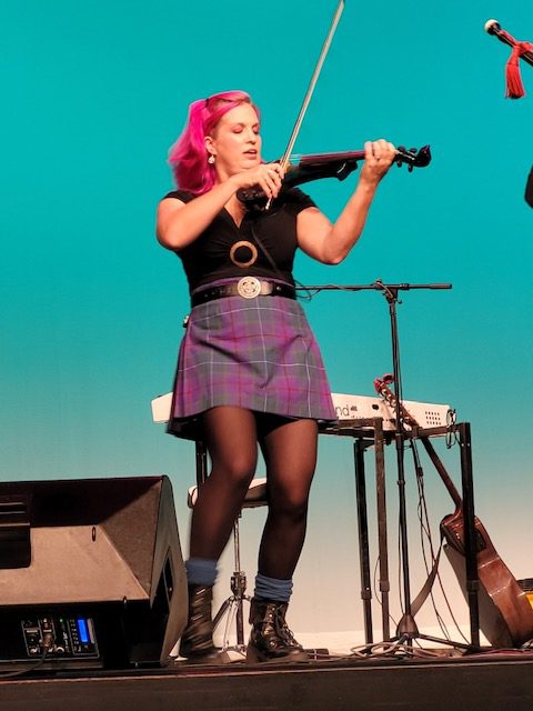 a woman performing at American Rogues